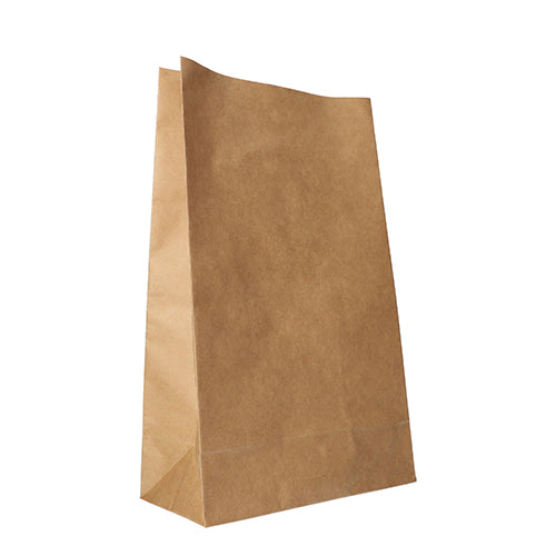 A PAPSTAR 250 block bottom bag made of brown kraft paper from PAPSTAR GmbH stands upright on a white background. The unprinted bag has a flat bottom and a slightly irregular top edge.