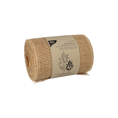 The decorative ribbon jute 10 m natural from PAPSTAR GmbH is a natural-colored jute ribbon roll with a brown paper label with black text and botanical art. The upright roll is ideal for natural decoration and is placed on a white background.