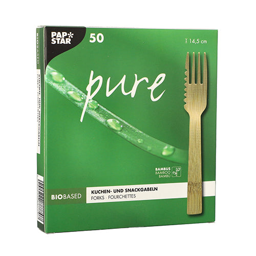 A green PAPSTAR pure box contains 50 eco-friendly, bio-based bamboo snack forks (14.5 cm, serrated) from PAPSTAR GmbH. The front shows a fork, a bamboo leaf with droplets, and is labeled with German, French, and English text.