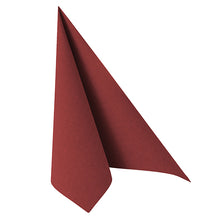 A neatly folded PAPSTAR GmbH 50 Napkins "ROYAL Collection" 1/4-fold 40 x 40 cm in burgundy stands upright in a triangular shape against a white background.