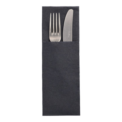 A silver fork and a silver knife from the DAILY Collection lie side by side in a dark gray napkin (48x30 cm) by PAPSTAR GmbH "DAILY Collection" with cutlery fold, partially visible over the edge of the napkin.