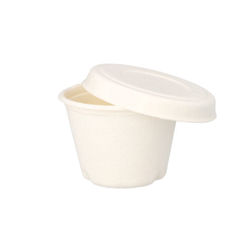 A small, white PAPSTAR "pure" sugarcane dressing cup lid from PAPSTAR GmbH with a smooth, matte surface and simple design is partially open on a matching cup against a white background.