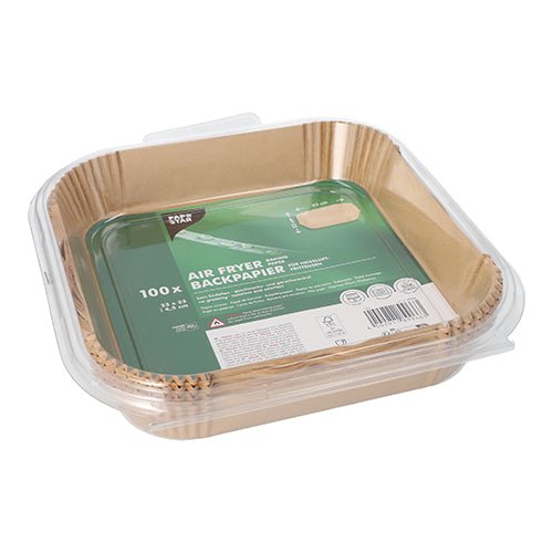 A transparent plastic container from PAPSTAR GmbH holds 100 square, non-stick baking papers for square air fryers. The green label provides product information, eco-friendly symbols, and usage instructions.