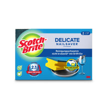 Abgebildet ist eine Schachtel Scotch-Brite® Delicate nicht kratzender Griffschwamm der 3M Deutschland GmbH mit einer Verpackung, die Produktabbildungen, das Scotch-Brite-Logo und einen deutschen Text für die kratzfreie Reinigung auf empfindlichen Oberflächen enthält.