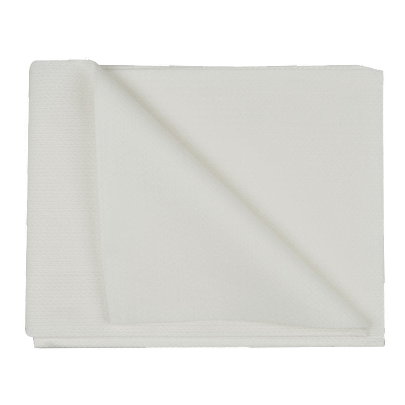 A disposable towel, airlaid, white from Abena Re-Seller GmbH lies on a white background, with one corner folded up to show the structure and thickness of the high-quality disposable fabric.