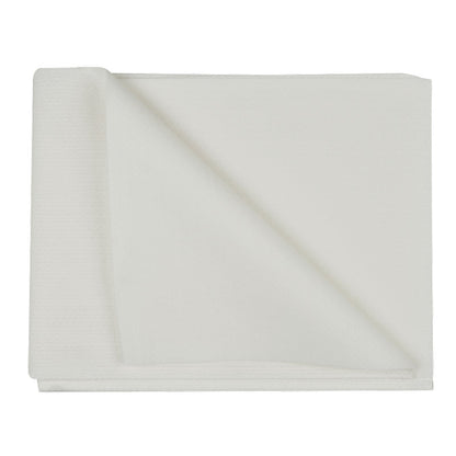 A disposable towel, airlaid, white from Abena Re-Seller GmbH lies on a white background, with one corner folded up to show the structure and thickness of the high-quality disposable fabric.