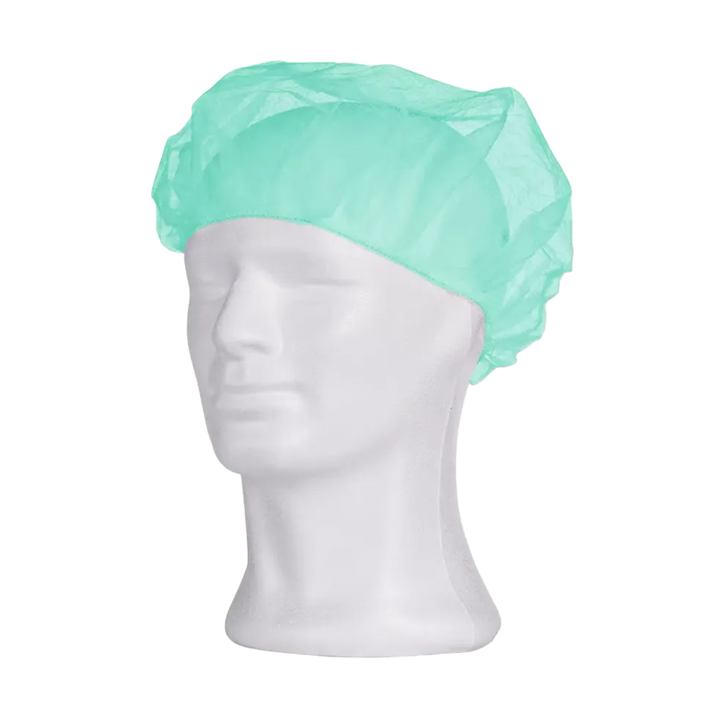 A light blue AMPri MED-COMFORT beret cap from AMPri Handelsgesellschaft mbH is shown on a white mannequin head. The disposable cap fully covers the top and back of the head and is often used in hygienic applications such as medical or cleanroom environments to ensure hygiene. The mannequin's face is expressionless and without contours.