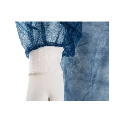 Close-up of a mannequin's hand wearing a blue, semi-transparent garment with a white elastic cuff. This AMPri MED-COMFORT PP disposable visitor gown with tie and knitted cuffs, manufactured by AMPri Handelsgesellschaft mbH, is made from crinkled polypropylene material and offers a comfortable fit around the wrist.