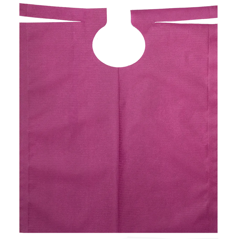 A flat, purple patient gown made of non-woven fabric with PE coating by AMPri Handelsgesellschaft mbH features a circular grip opening at the top center. The material appears textured and the unfolded gown reveals its rectangular shape.