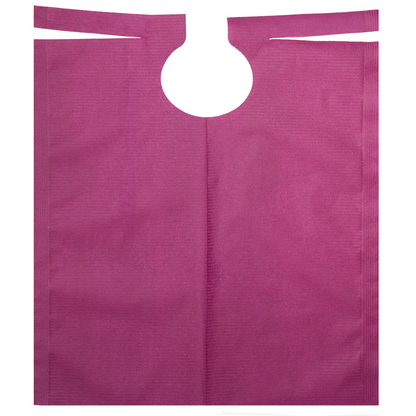 A flat, purple patient gown made of non-woven fabric with PE coating by AMPri Handelsgesellschaft mbH features a circular grip opening at the top center. The material appears textured and the unfolded gown reveals its rectangular shape.