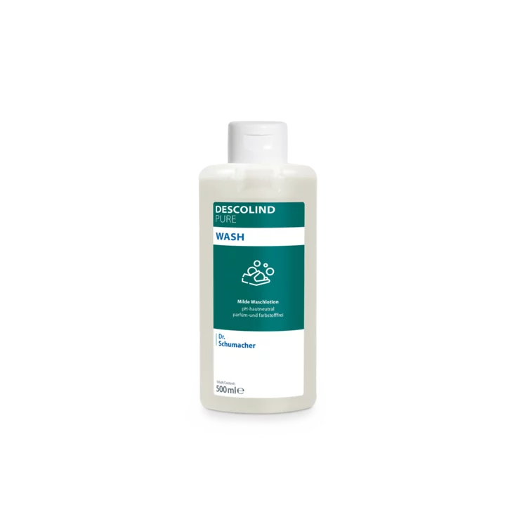 A white plastic bottle of Dr. Schumacher Descolind Pure Wash Lotion (500 ml) by Dr. Schumacher GmbH, with a green-white label, stands in front of a plain light gray background. This pH-skin-neutral perfume-free wash lotion is ideal for sensitive skin.