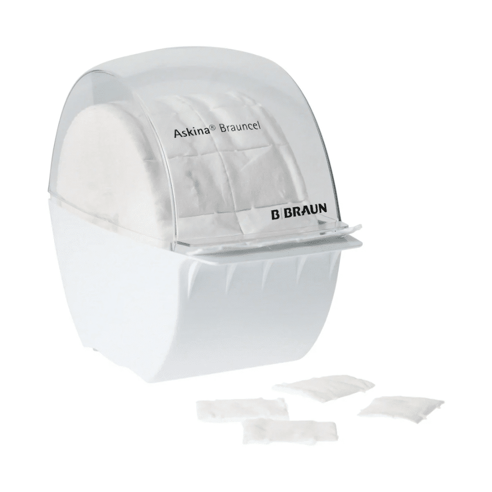 A B. Braun Askina® Brauncel® dispenser for cellulose swabs - empty from B. Braun Deutschland GmbH & Co. KG is a white plastic dispenser with a transparent lid, designed to hold cellulose swabs. In front, four identical squares facilitate hygienic removal.