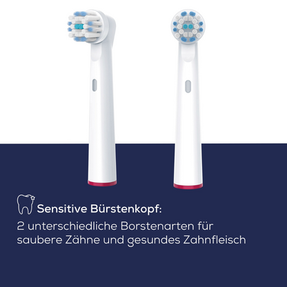 Two white electric toothbrush heads against a dark blue background. The text below reads: "Beurer Sensitive brush head for TB 30 / TB 50: 2 different types of bristles for clean teeth and healthy gums." with a small tooth icon. Compatible with rotating toothbrushes, replacement set available. Brand: Beurer GmbH.