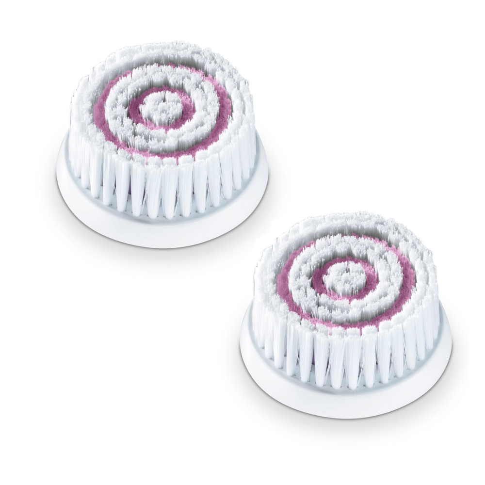 Pictured are two replacement brush heads for the Beurer FC 95 facial brush. Each sensitive brush attachment from Beurer GmbH consists of concentric circles of soft bristles, with the outer edges being white and the inner circles pink. They are arranged side by side on a white background.