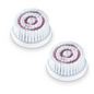 Pictured are two replacement brush heads for the Beurer FC 95 facial brush. Each sensitive brush attachment from Beurer GmbH consists of concentric circles of soft bristles, with the outer edges being white and the inner circles pink. They are arranged side by side on a white background.