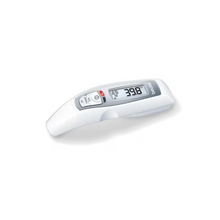 A Beurer FT 65 multifunction thermometer contactless from Beurer GmbH in white shows a temperature of 39.8 °C on its LCD screen. The device, designed for quick measurements, features buttons for turning on and measuring, with the brand name "Beurer" visible on the side. The thermometer is lying on a white surface.