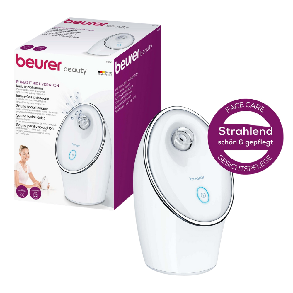 The Beurer Ion Facial Sauna FC 72 Pureo Ionic Hydration by Beurer GmbH in white with ion technology for deep-cleansing effect is depicted on the front of its packaging. The device features a round nozzle and a blue power button. The packaging highlights the product benefits in multiple languages and includes a round label with the inscription "Radiantly beautiful & well-groomed."