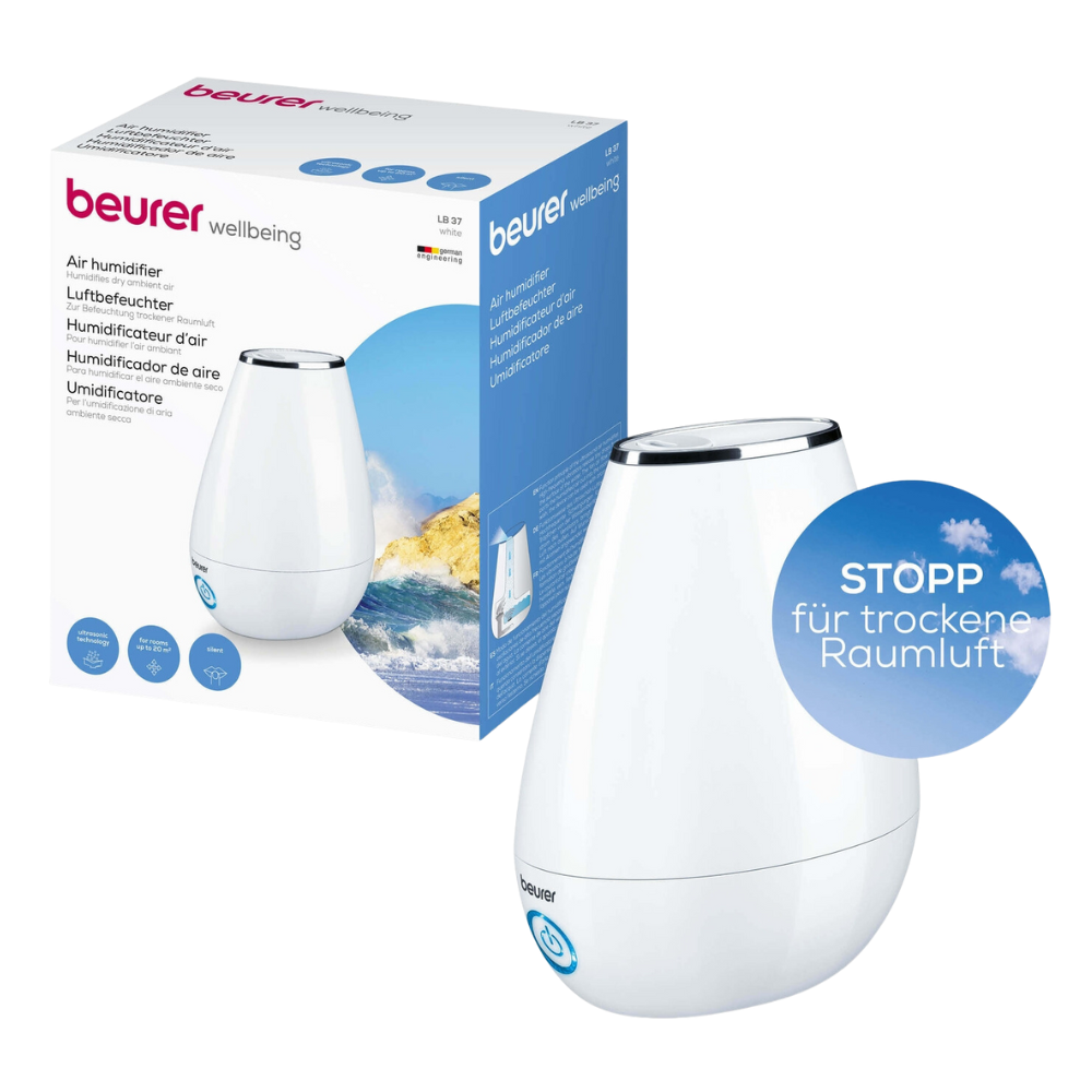 Image of a Beurer LB 37 humidifier product with packaging. The humidifier from Beurer GmbH features an elegant, white, drop-shaped design with a blue power button and advanced ultrasonic humidification technology. The packaging also shows the product image and various descriptions in multiple languages.