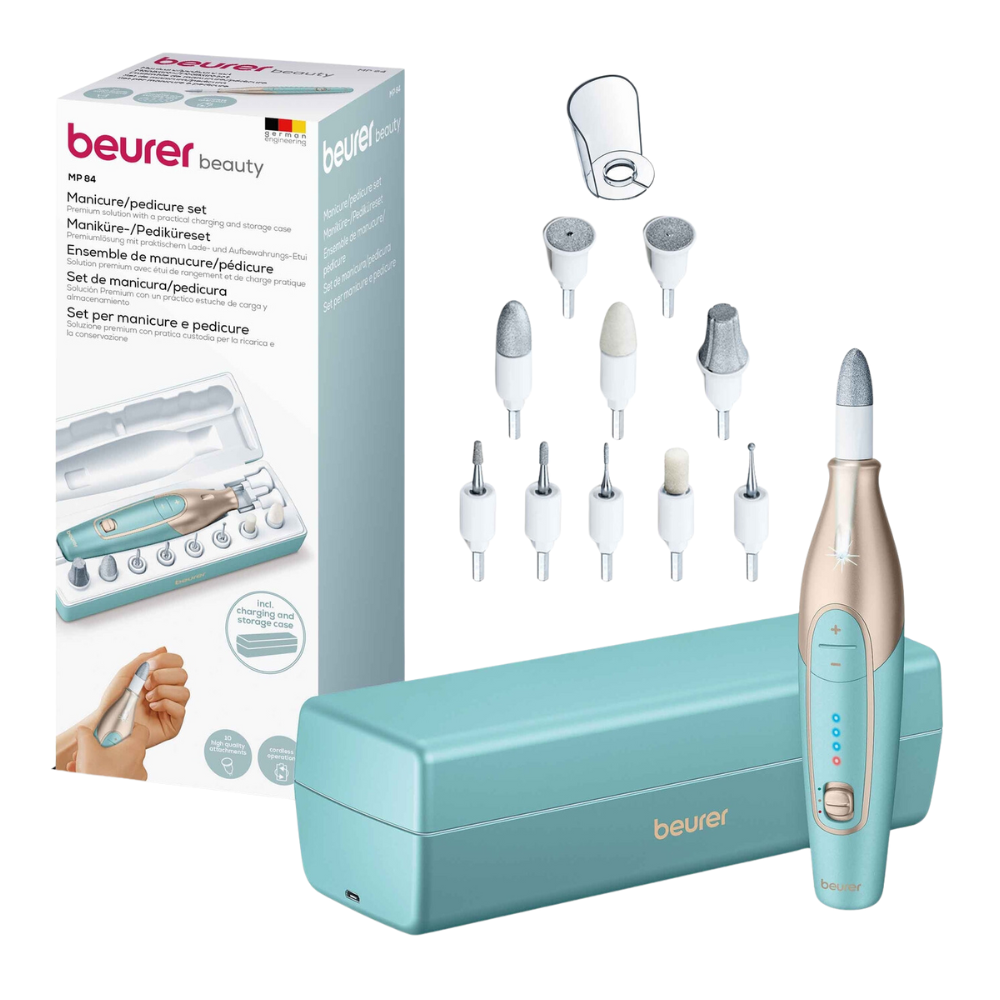 The illustration shows a Beurer portable manicure & pedicure set MP 84 | Package (1 piece) for manicure and pedicure. The set includes a main device, seven different attachment heads, and a storage case. Also visible is the product box with the Beurer GmbH brand and product information.