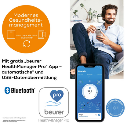 An advertisement image presenting the app "beurer HealthManager Pro". The image shows a man holding a smartphone displaying the app interface, which is connected to the Beurer diagnostic scale BF 105 BodyComplete by Beurer GmbH. The text highlights Bluetooth transmission, automatic USB data transfer, and free app access.