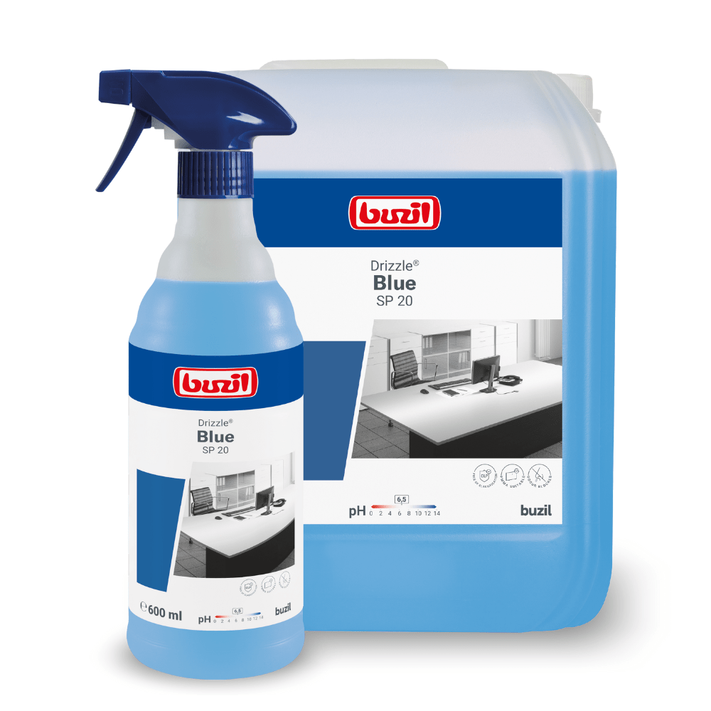 Two containers of Buzil Drizzle® Blue SP 20 ready-to-use surface cleaner with odor blocker from BUZIL-WERK Wagner GmbH & Co. KG will be on display. The smaller one is a 600-ml spray bottle, while the larger one is a refill container. Both feature an image of a desk and product information, highlighting material compatibility, pH value, and usage instructions for optimal cleaning performance.