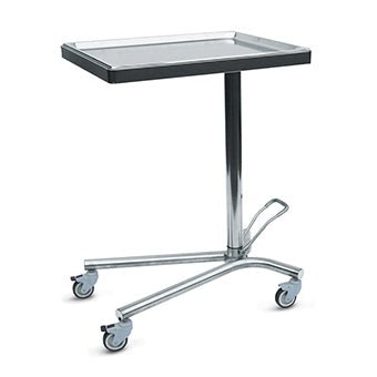 The Novocal operating table side table is made of stainless steel and features a fixed, removable, and sterilizable tray. It has a rectangular top, a central column, a three-legged base with four swivel casters, and a foot pedal near the base.