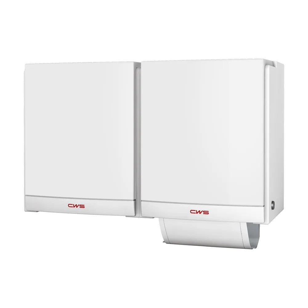 Two white CWS front panels for DUO fabric towel dispensers from CWS are mounted side by side. The right dispenser has a partially pulled-out paper towel; both bear the red CWS logo, emphasizing their hygienic design.