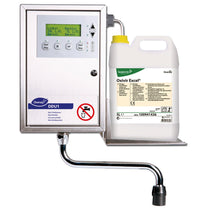 A wall-mounted Diversey DDU1 digital dosing unit for Oxivir Excel 2x5l with display and buttons is installed next to a 5-liter container of Oxivir Excel, which is held on its tray to enable precise dosing.