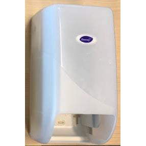 The DI System Roll Dispenser for toilet paper from Diversey Deutschland GmbH & Co. OHG is a white, wall-mounted dispenser with a translucent front cover and an oval label, depicted against a light wooden background.