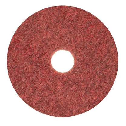 The Diversey Twister Pad TXP scrubbing pad for stone floors from Diversey Deutschland GmbH & Co. OHG is a circular red pad with a rough texture and central hole, designed for cleaning stone floors (from above on a white background).