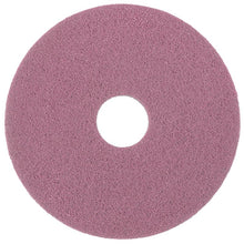 The Diversey Twister Pad Pink for vinyl floors from Diversey Deutschland GmbH & Co. OHG is a round, pink cleaning pad with a central hole and rough texture, ideal for tough cleaning tasks on vinyl floors with microscopic diamonds.