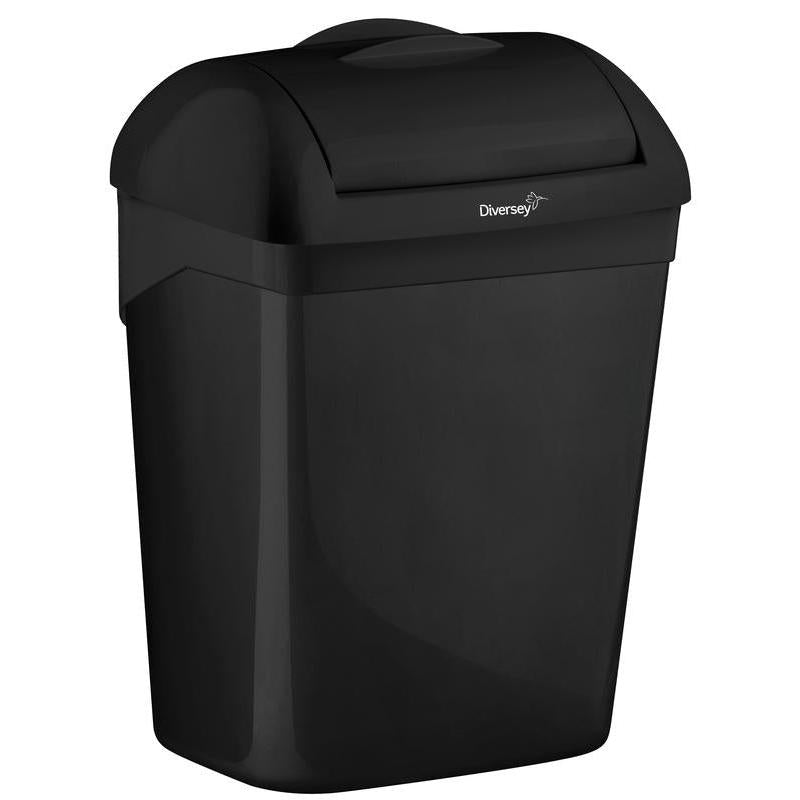 The Diversey waste bin for hygiene bags 8 L by Diversey Deutschland GmbH & Co. OHG is a black plastic container with a domed lid and flap opening, rectangular with rounded edges, perfect for hygienic waste disposal in any environment.
