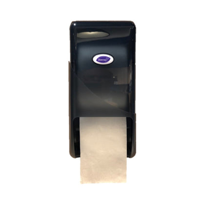 A black plastic DI System Roll Dispenser for toilet paper from Diversey Deutschland GmbH & Co. OHG, wall-mounted with visible white paper hanging below and an oval "Diversey" logo on the front, ideal for public restrooms.