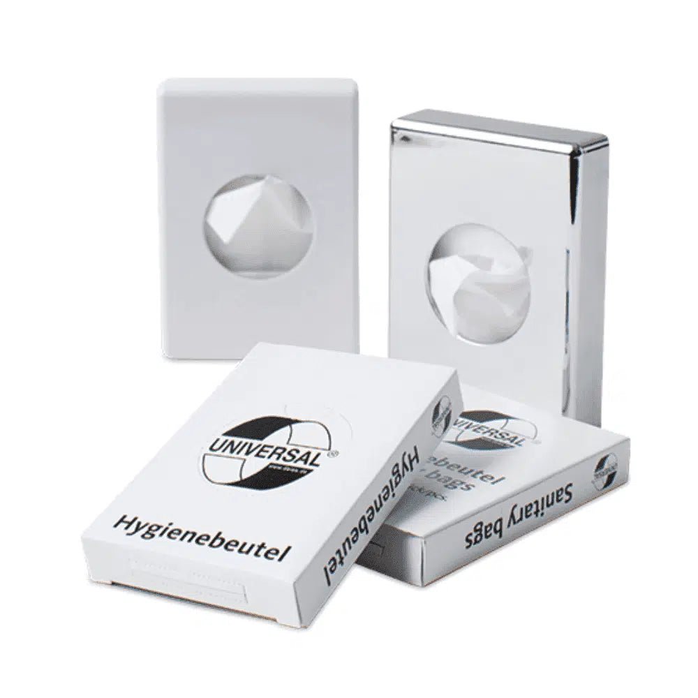 Displayed are four white dispensers for hygiene bags. Two dispensers have a glossy surface and the other two have a matte one. The dispenser at the front is labeled "Hygienebeutel Hygiene Bags" with a globe logo, is specifically designed for feminine hygiene products, and is made from durable PE-HD film material. The product is known as DEISS Universal Hygiene Bags by the brand EMIL DEISS KG (GmbH + Co.) and contains 30 bags per package.