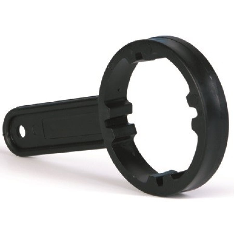The Dr. Schumacher canister key (1 piece) from Dr. Schumacher GmbH is a black plastic tool with a notched, round end and a flat handle, ideal for loosening round fastenings like water filter housings. Pictured on a white background.