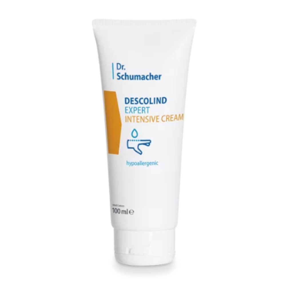 A white tube with the inscription "Dr. Schumacher Descolind Expert Intensive Cream | Tube (100 ml)" from Dr. Schumacher GmbH stands upright against a plain background. The packaging features a yellow rectangle and a drop symbol, emphasizing its hypoallergenic properties, making it perfect for sensitive skin.