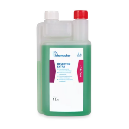 A 1-liter bottle of Dr. Schumacher DESCOTON EXTRA disinfectant by Dr. Schumacher GmbH for instrument disinfection. The bottle is partially filled with a green liquid and has two caps: a white one on the left for pouring and a red one on the right. The label contains detailed product information and application instructions.