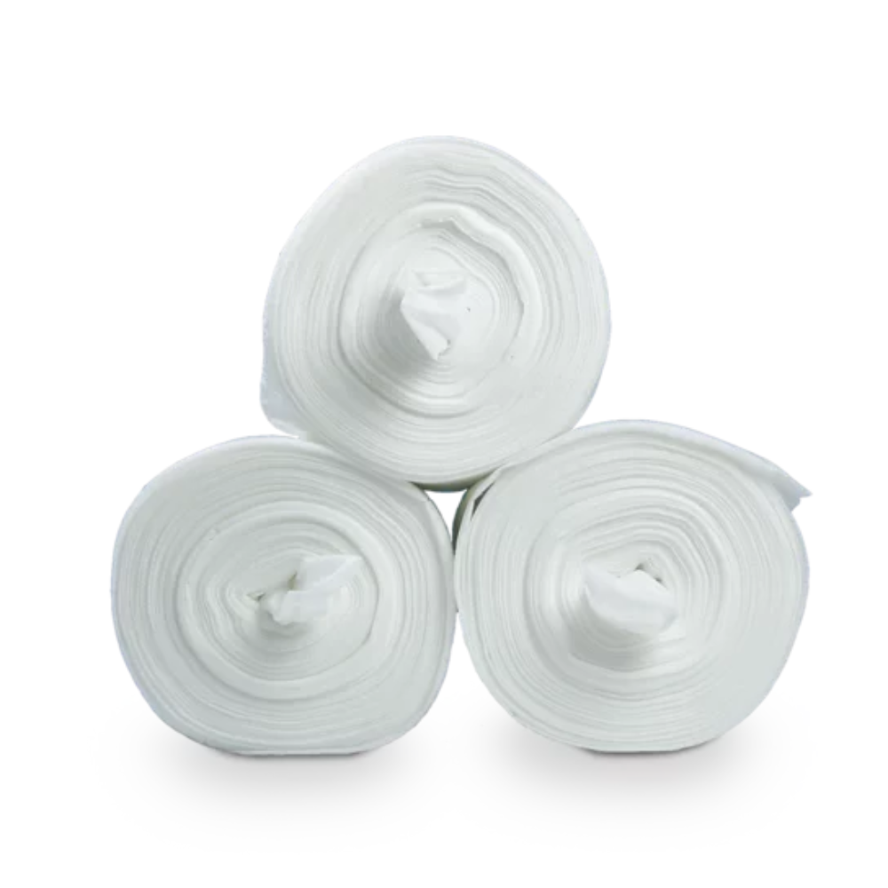 Three large white rolls of fabric, specifically Dr. Schumacher Decso Wipes RT, non-woven cloth rolls, are stacked in a triangular formation against a plain white background. Each roll is tightly wound and reveals its inner hollow core in the middle.