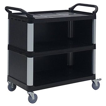 A black Novocal multipurpose cart made of plastic with three enclosed plastic shelves, silver columns, raised handles at both ends, and four swivel casters. The empty cart is photographed against a white background.