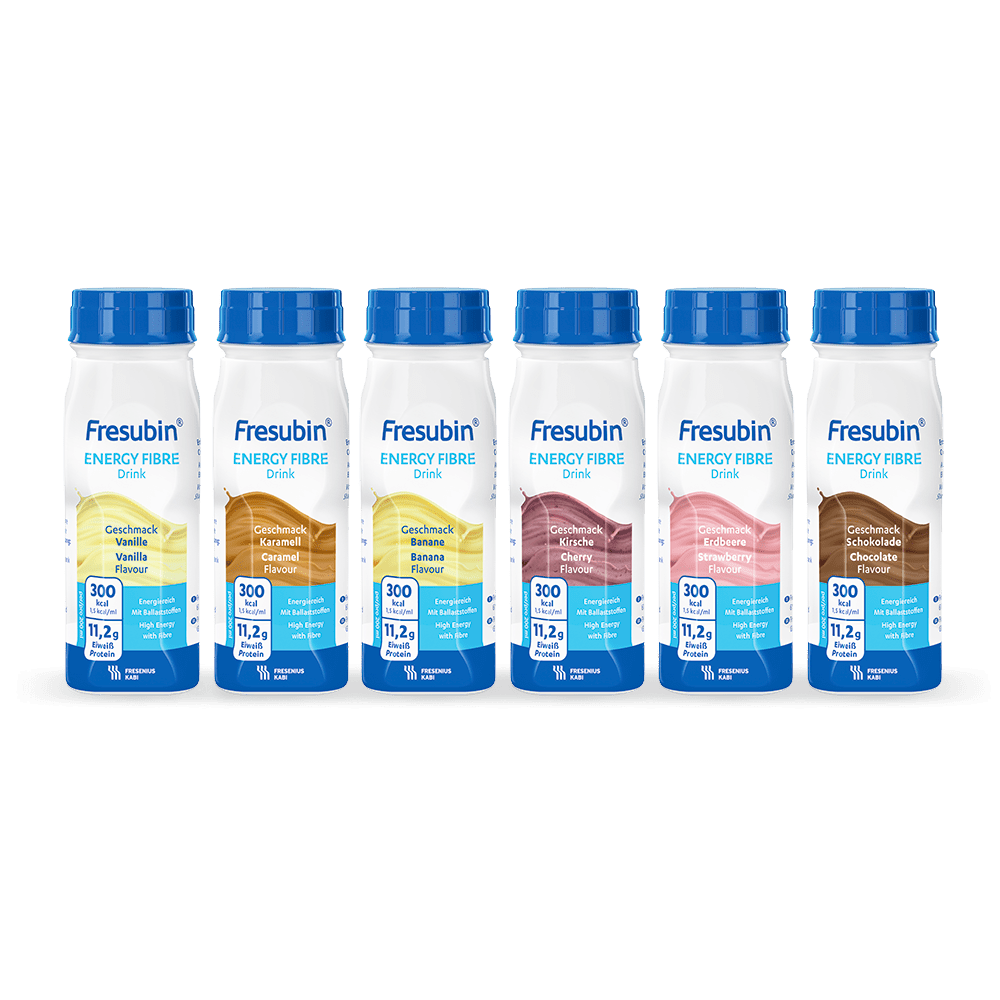Six bottles of Fresubin Energy Fibre Drink mixed carton 200 ml from Fresenius Kabi Deutschland GmbH are lined up, each with a blue cap and label. Displayed flavors: Vanilla, Caramel, Banana, Strawberry, Chocolate, and Cappuccino.