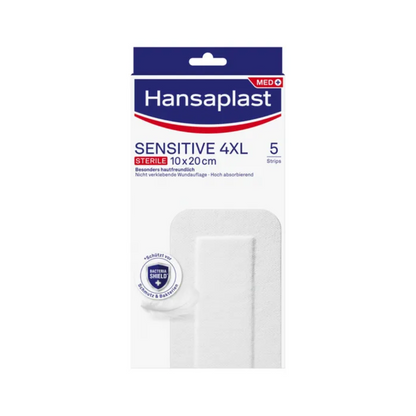 The image shows a pack of Hansaplast Sensitive XL, sterile, particularly skin-friendly from Beiersdorf AG, containing sterile wound care 4XL wound dressings measuring 10x20 cm. The pack indicates that there are 5 strips inside. The packaging is predominantly white with blue and red accents and contains text highlighting the features.