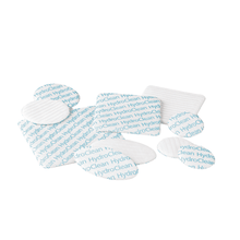 A collection of four white and blue Hartmann HydroClean® wound dressings from Paul Hartmann AG, arranged on a white background.