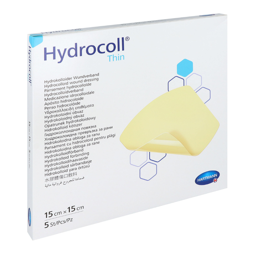 A box of Hartmann Hydrocoll® thin dressing hydrocolloid wound dressing by Paul Hartmann AG. The packaging is white with blue and yellow design elements and text in multiple languages. It measures