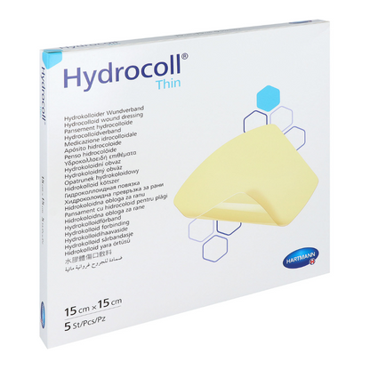 A box of Hartmann Hydrocoll® thin dressing hydrocolloid wound dressing by Paul Hartmann AG. The packaging is white with blue and yellow design elements and text in multiple languages. It measures