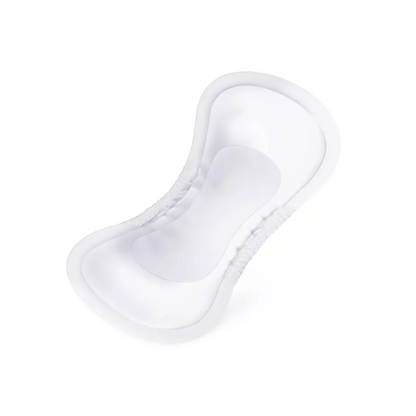 Pictured is a white, ergonomically shaped Paul Hartmann AG Hartmann MoliCare Pad Night incontinence pad. The pad has raised, elastic edges for better fit and protection as well as a smooth central area for more absorbency. The product was developed for urine incontinence management and appears unused and clean against a white background.