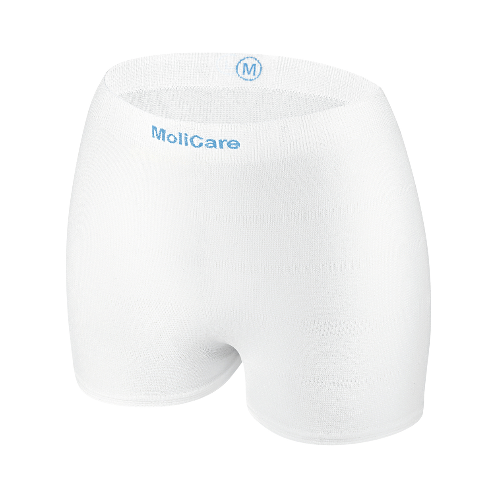 Hartmann MoliCare® Fixpants mesh pants by Paul Hartmann AG are white, seamless elastic mesh underpants with a blue 'M' and brand on the waistband, ideal for securing incontinence pads in medium size.