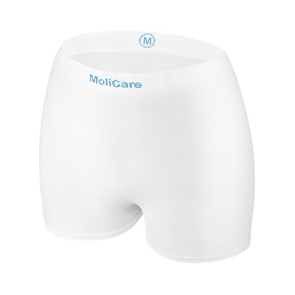 Hartmann MoliCare® Fixpants mesh pants by Paul Hartmann AG are white, seamless elastic mesh underpants with a blue 'M' and brand on the waistband, ideal for securing incontinence pads in medium size.