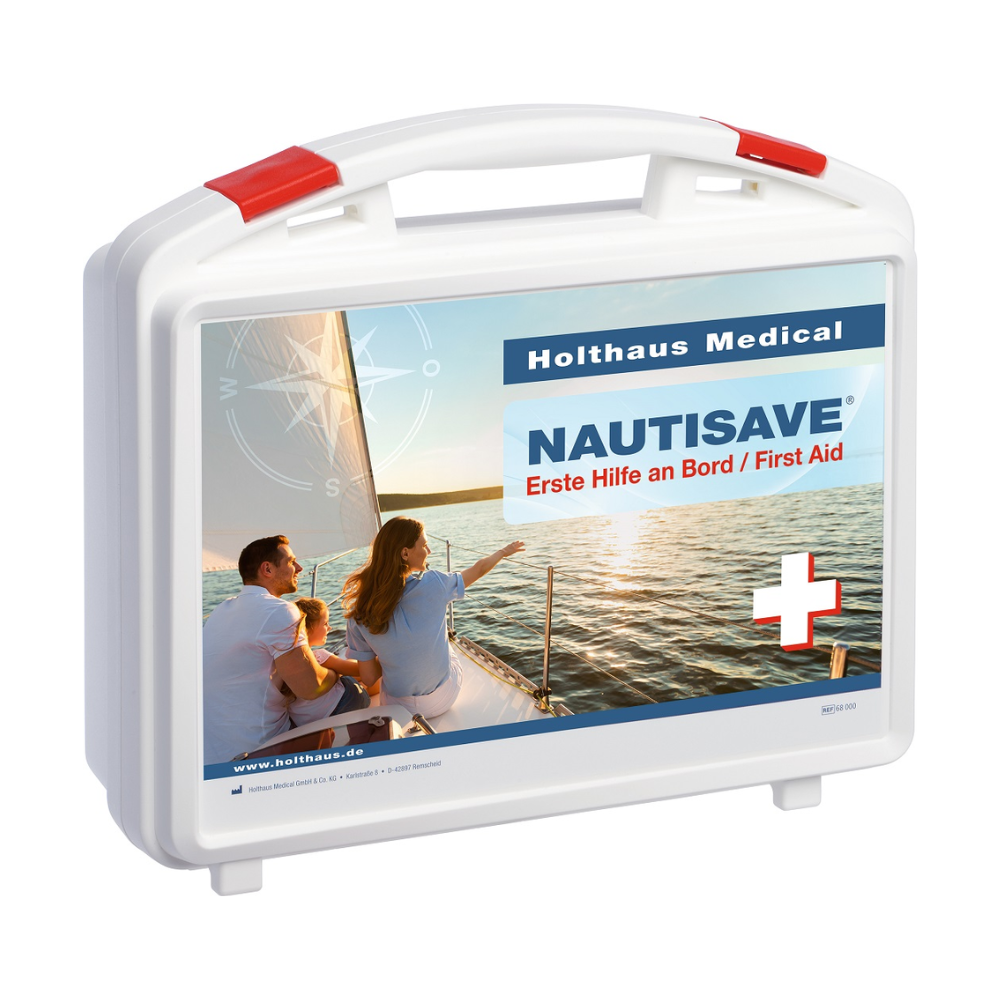 A white Holthaus Nautisave® first aid kit with red accents, labeled with "Holthaus Medical NAUTISAVE Erste Hilfe an Bord / First Aid". The front of the backpack shows an image of two people on a sailboat at sunset, making it ideal for maritime environments.