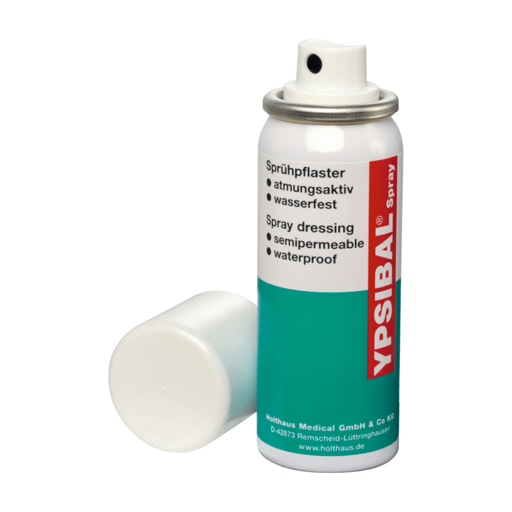 An aerosol can of Holthaus Ypsibal® Spray, spray plaster - 50 ml from Holthaus Medical GmbH & Co. KG is displayed without a white cap and leans on the base. The text on the predominantly white can with blue-green sections and red accents indicates that it is a semi-permeable, waterproof, breathable spray bandage for cuts and abrasions.
