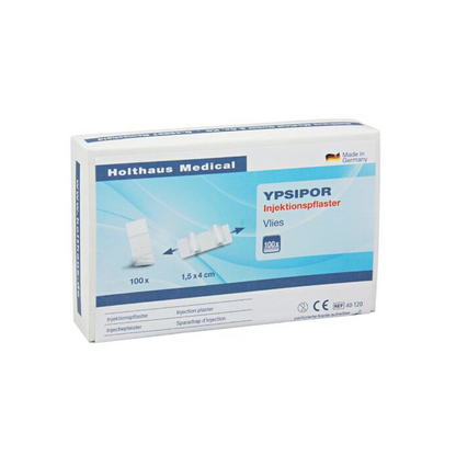 Displayed is a box of Holthaus Ypsipor injection plasters from Holthaus Medical GmbH & Co. KG. The predominantly white packaging with blue accents contains 100 plasters measuring 1.5x4 cm. The box contains German text and an image of the plasters.